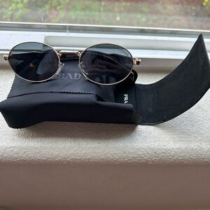 Prada Black and Gold Oval Sunglasses